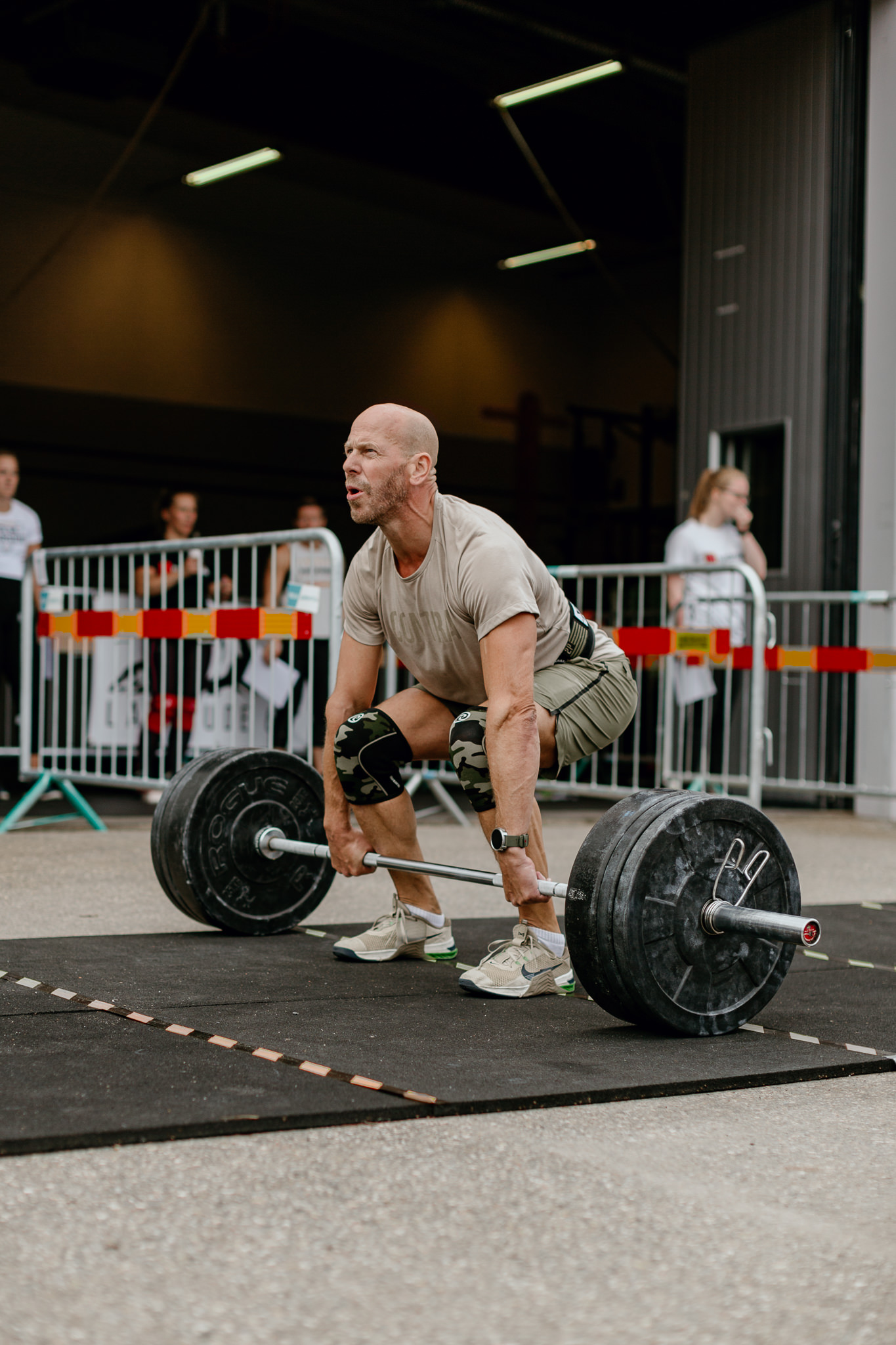 man lifting weights outdoors. eye-candy