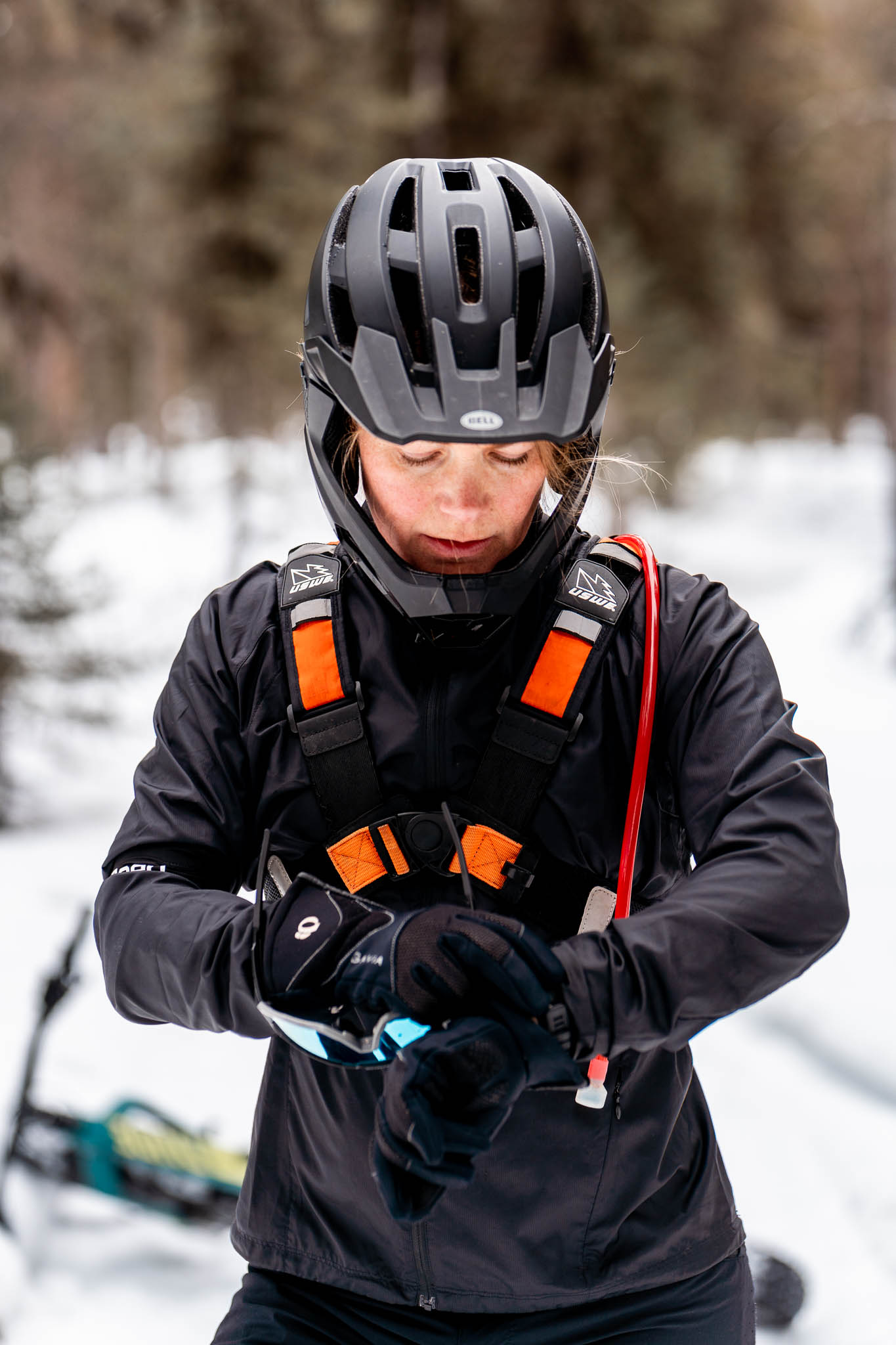 Malin looking at her watch with the fatbike in the background